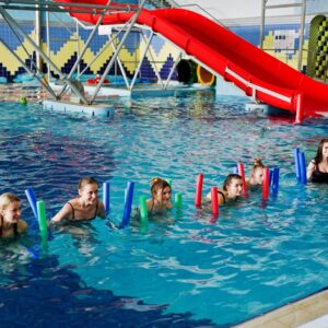 fitness-group-girls-doing-aerobical-excercises-swimming-pool-aqua-park-sport-leisure-activities_627829-10857